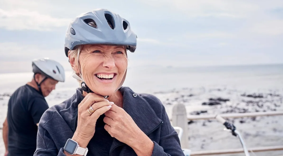 Women smiling confidently after All on 4 implants.