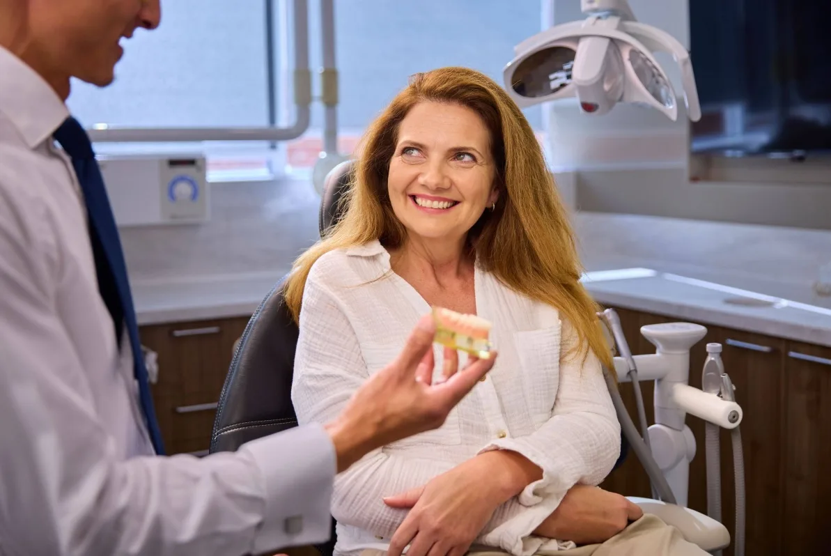 Patient having conversation about All On 4 implant pricing during consultation.